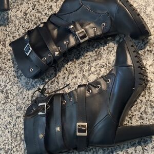 Black calf length boots.
